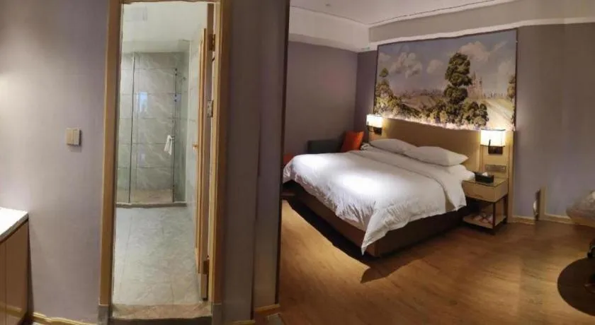 Bed in Vienna Hotel Guangxi Baise Xilin County Juting Cultural Arts Center