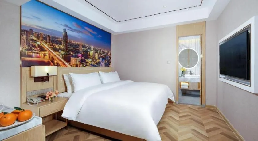 Bed in Vienna Hotel Guangxi Baise Xilin County Juting Cultural Arts Center