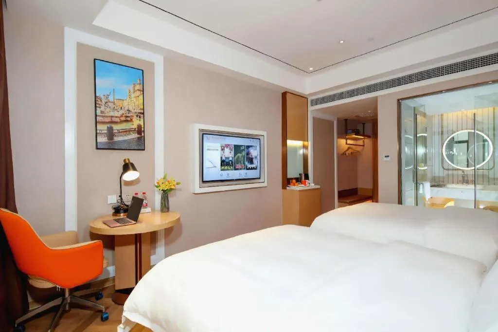 Bed in Vienna Hotel Guangxi Baise Xilin County Juting Cultural Arts Center