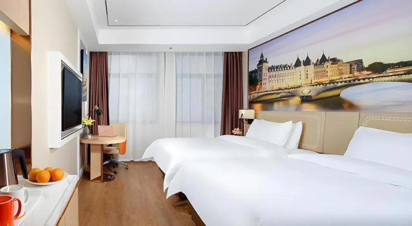 Bed in Vienna Hotel Guangxi Baise Xilin County Juting Cultural Arts Center