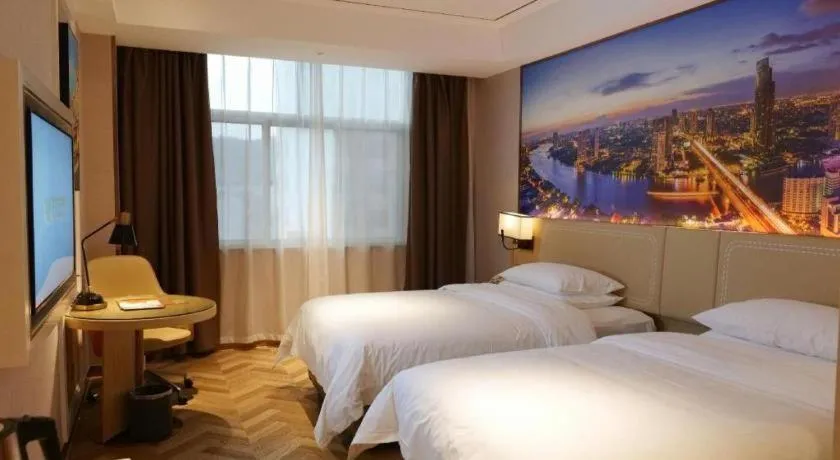 Bed in Vienna Hotel Guangxi Baise Xilin County Juting Cultural Arts Center