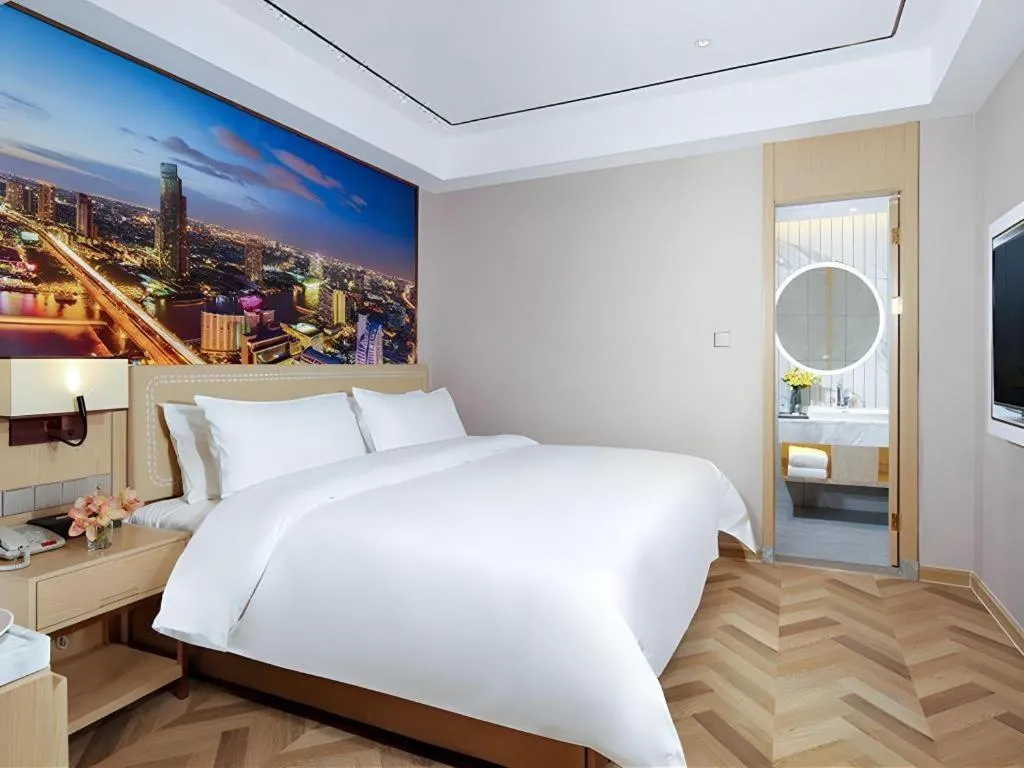 Bed in Vienna Hotel Guangxi Baise Xilin County Juting Cultural Arts Center