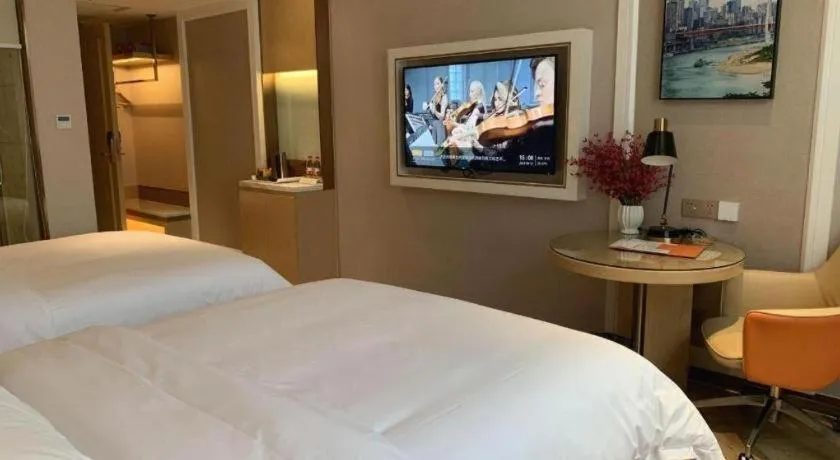 Bed in Vienna Hotel Guangxi Baise Xilin County Juting Cultural Arts Center