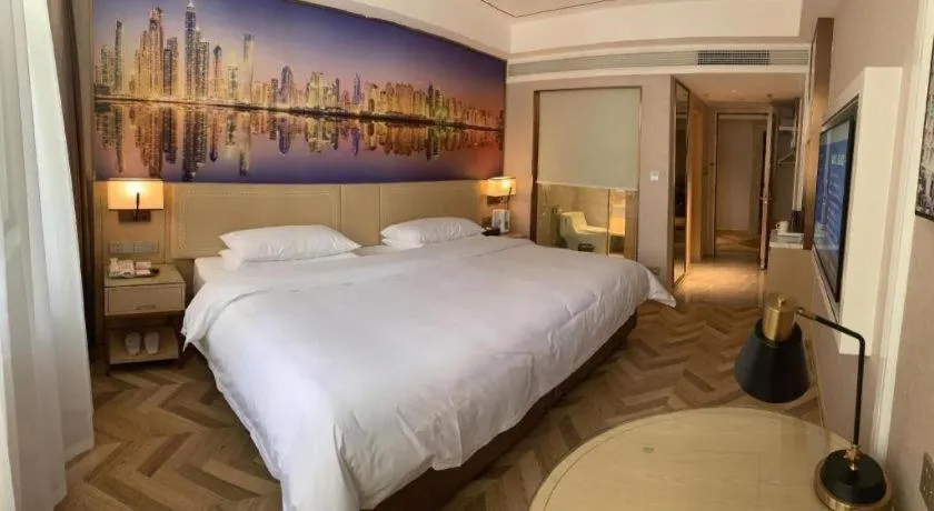 Bed in Vienna Hotel Guangxi Baise Xilin County Juting Cultural Arts Center