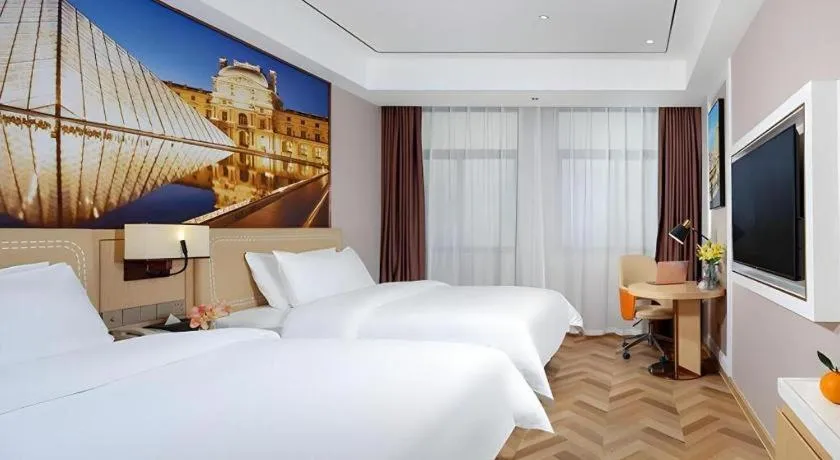 Bed in Vienna Hotel Guangxi Baise Xilin County Juting Cultural Arts Center