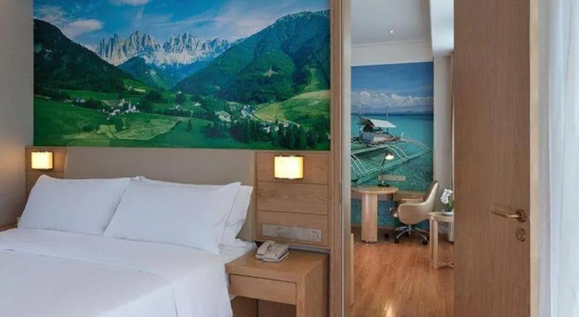 Bed in Vienna Hotel Guangxi Wuzhou High-Tech