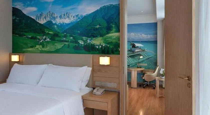 Bed in Vienna Hotel Guangxi Wuzhou High-Tech