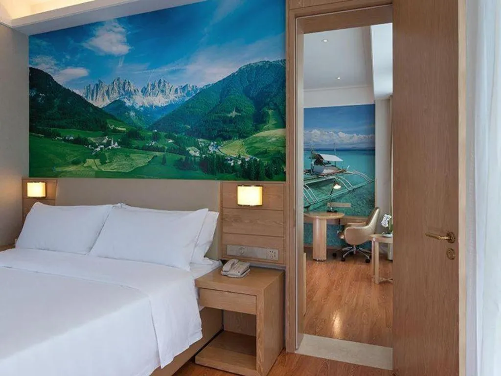 Bed in Vienna Hotel Guangxi Wuzhou High-Tech