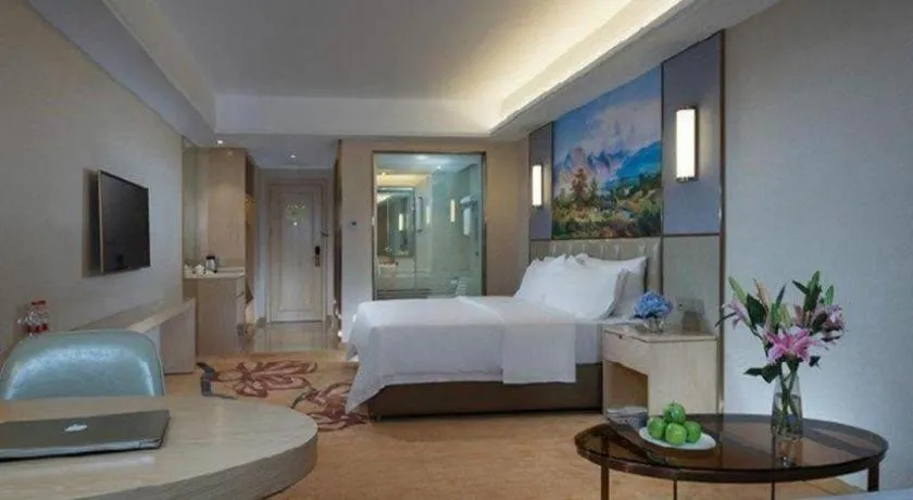 Bed in Vienna Hotel Guangxi Wuzhou High-Tech