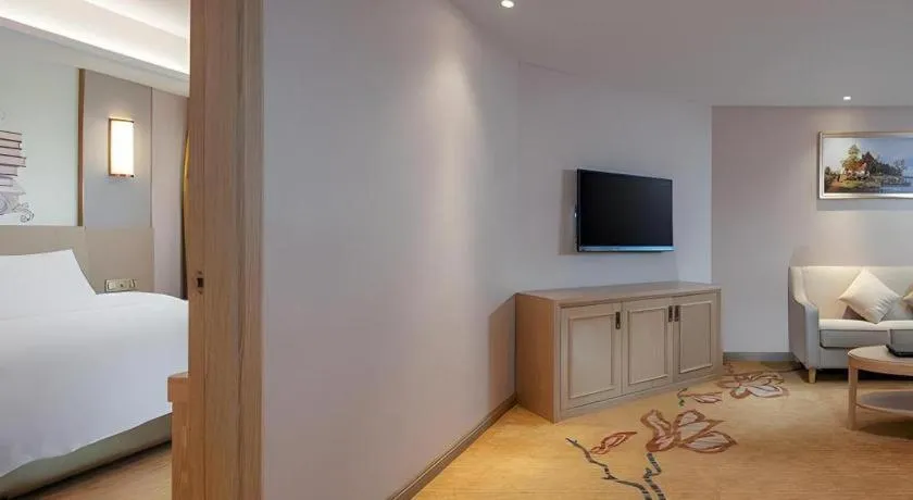 Bed in Vienna Hotel Guangxi Wuzhou High-Tech