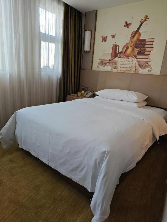 Bed in Vienna Hotel Guangxi Wuzhou High-Tech