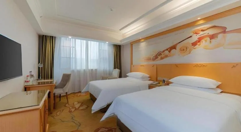 Bed in Vienna Hotel Guangdong Shaoguan Ruyuan Yao Cultural Square