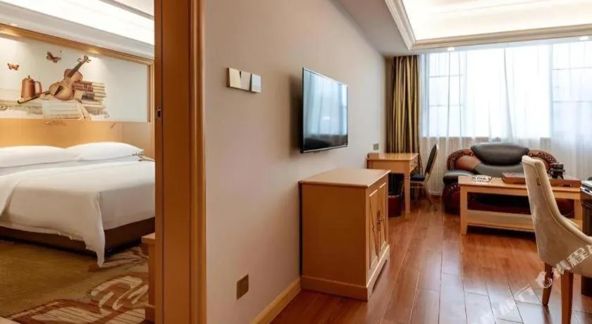 Bed in Vienna Hotel Guangdong Shaoguan Ruyuan Yao Cultural Square