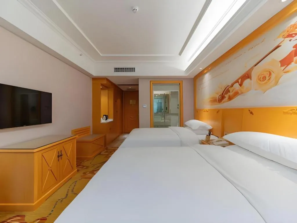 Bed in Vienna Hotel Guangdong Shaoguan Ruyuan Yao Cultural Square