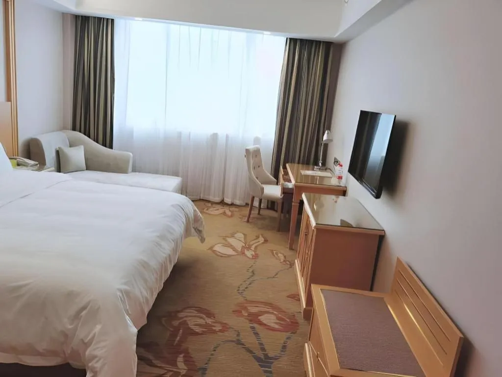 Bed in Vienna Hotel Guangdong Shaoguan Ruyuan Yao Cultural Square