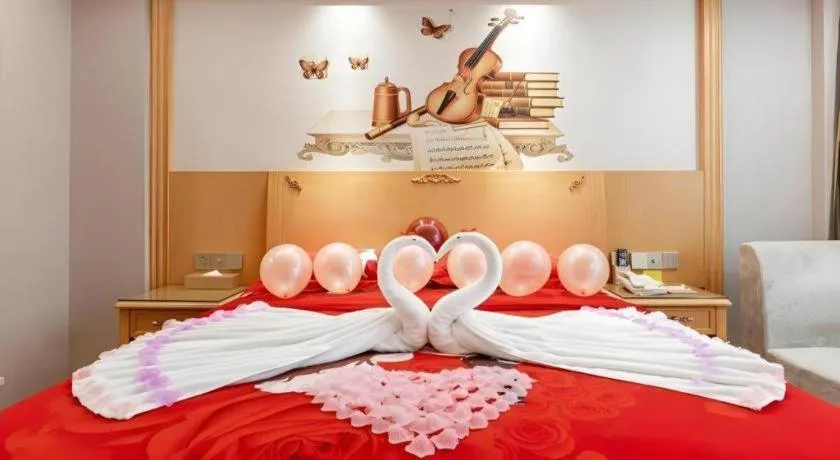 Bed in Vienna Hotel Guangdong Shaoguan Ruyuan Yao Cultural Square