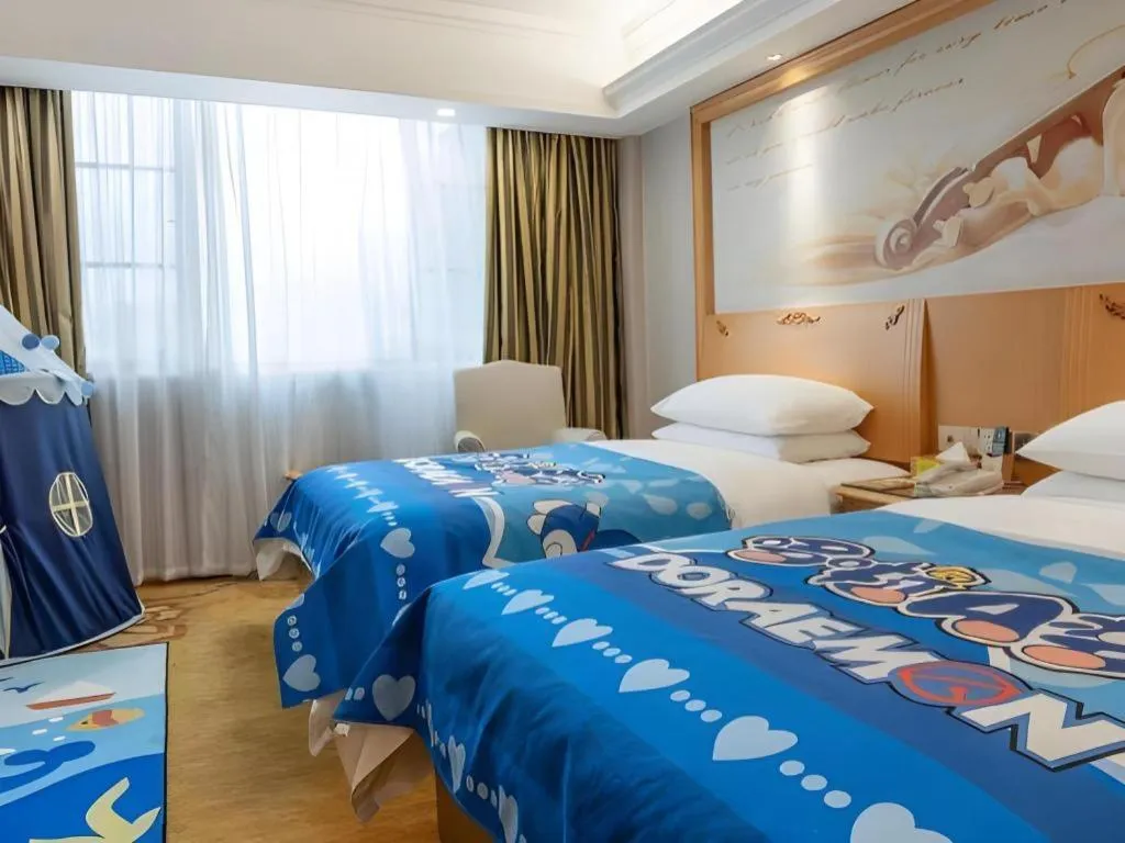 Bed in Vienna Hotel Guangdong Shaoguan Ruyuan Yao Cultural Square