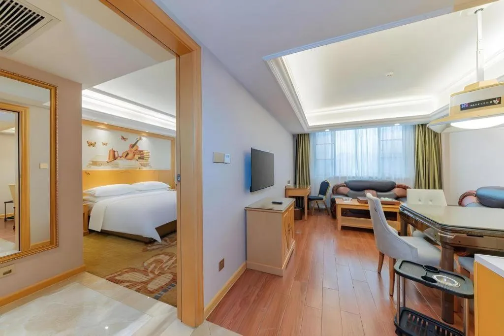 Bed in Vienna Hotel Guangdong Shaoguan Ruyuan Yao Cultural Square