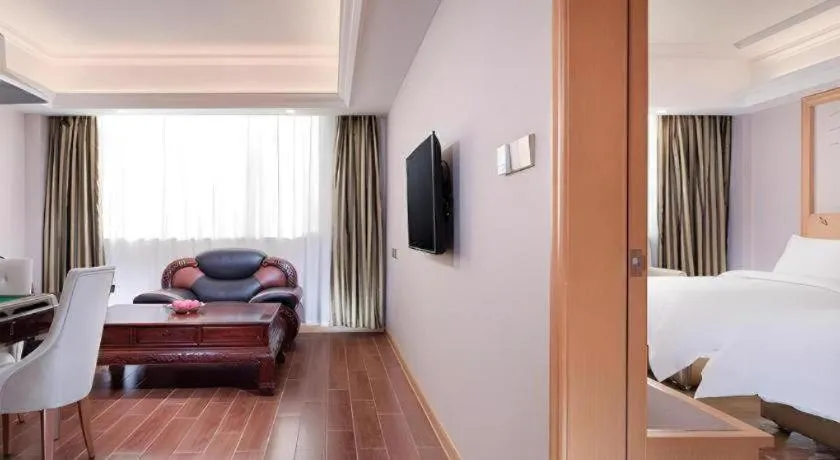 Bed in Vienna Hotel Guangdong Shaoguan Ruyuan Yao Cultural Square