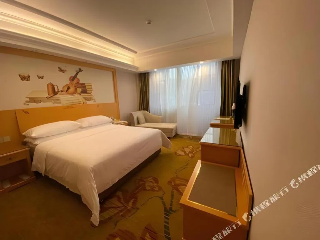 Bed in Vienna Hotel Guangdong Shaoguan Ruyuan Yao Cultural Square