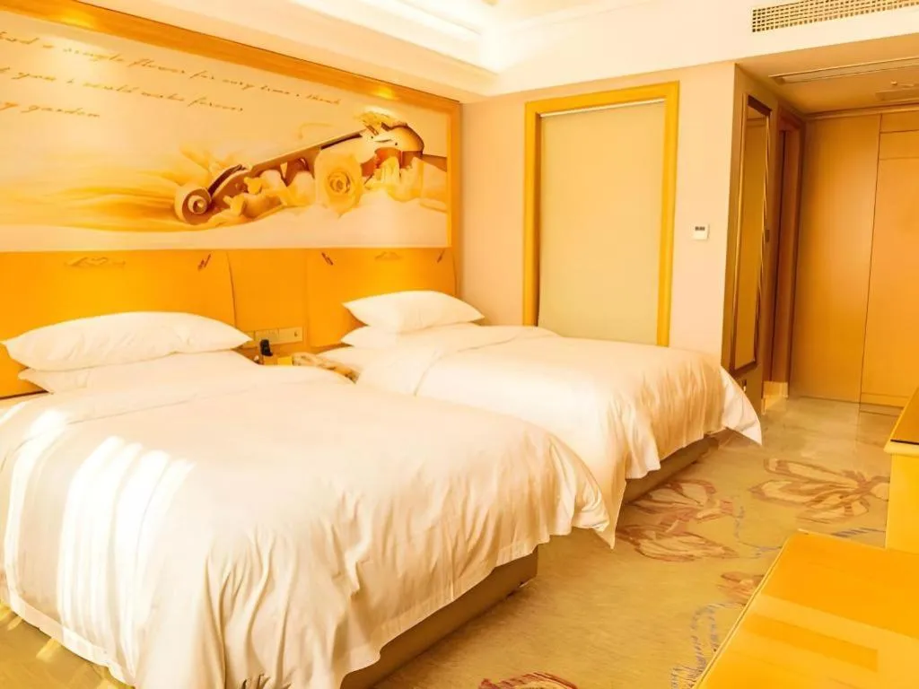 Bed in Vienna Hotel Guangdong Shaoguan Ruyuan Yao Cultural Square