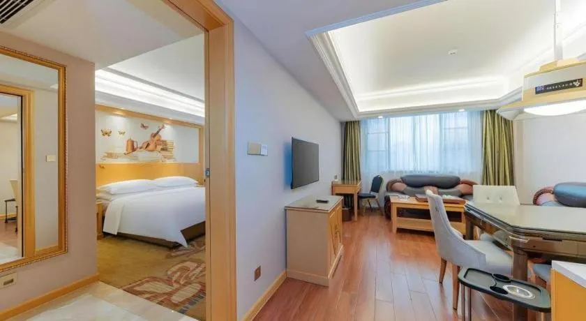 Bed in Vienna Hotel Guangdong Shaoguan Ruyuan Yao Cultural Square