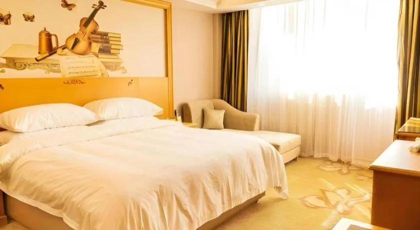 Bed in Vienna Hotel Guangdong Shaoguan Ruyuan Yao Cultural Square