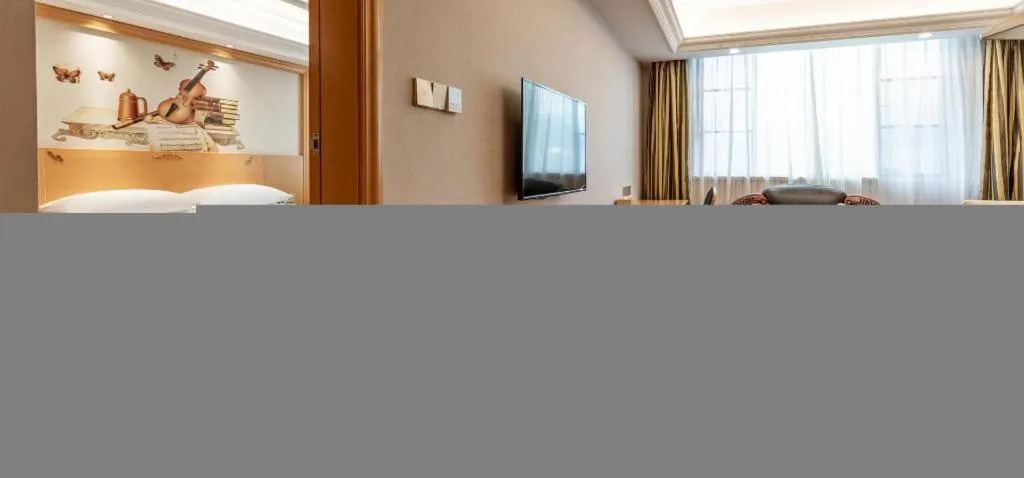 Bed in Vienna Hotel Guangdong Shaoguan Ruyuan Yao Cultural Square