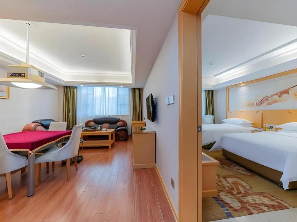 Bed in Vienna Hotel Guangdong Shaoguan Ruyuan Yao Cultural Square