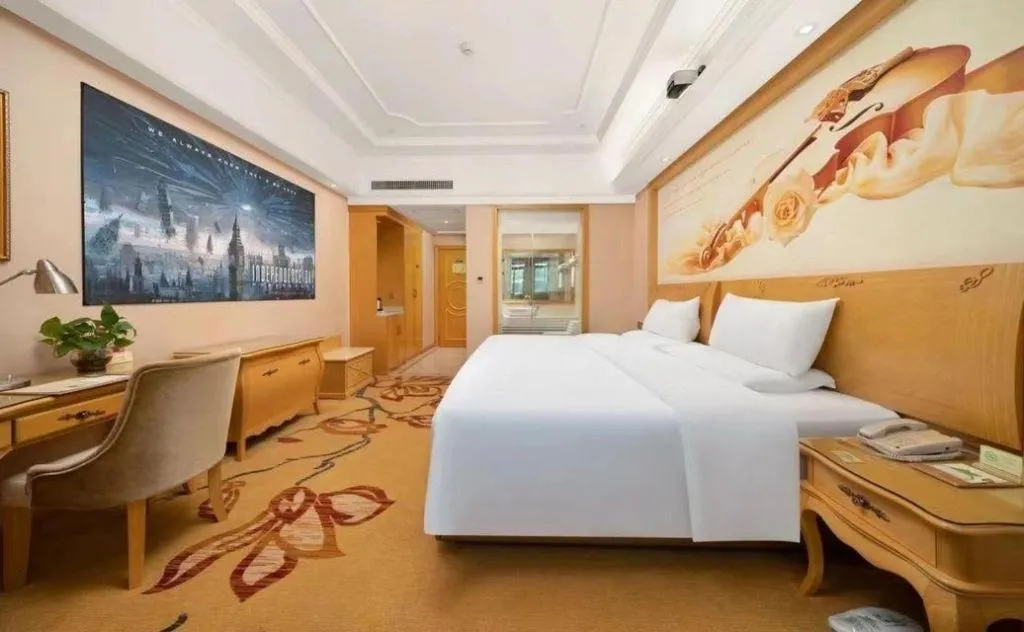 Bed in Vienna Hotel Guangdong Shaoguan Ruyuan Yao Cultural Square