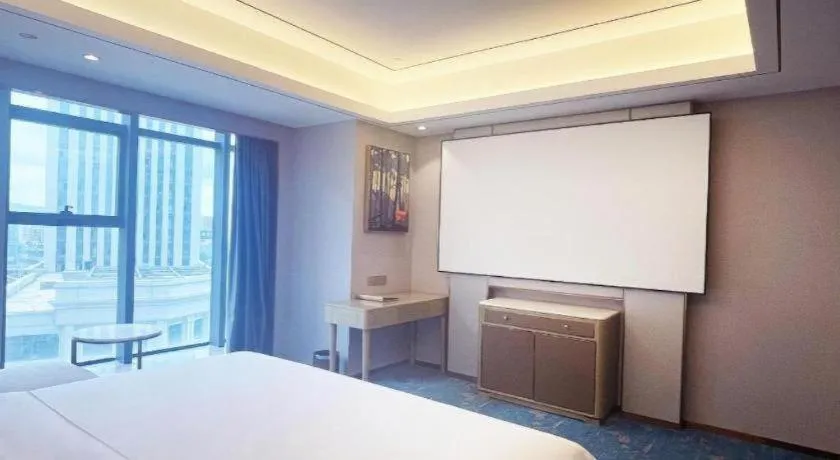 Bed in Venus Royal Hotel Guangxi Wuzhou Sanqicheng Meiguihu Park