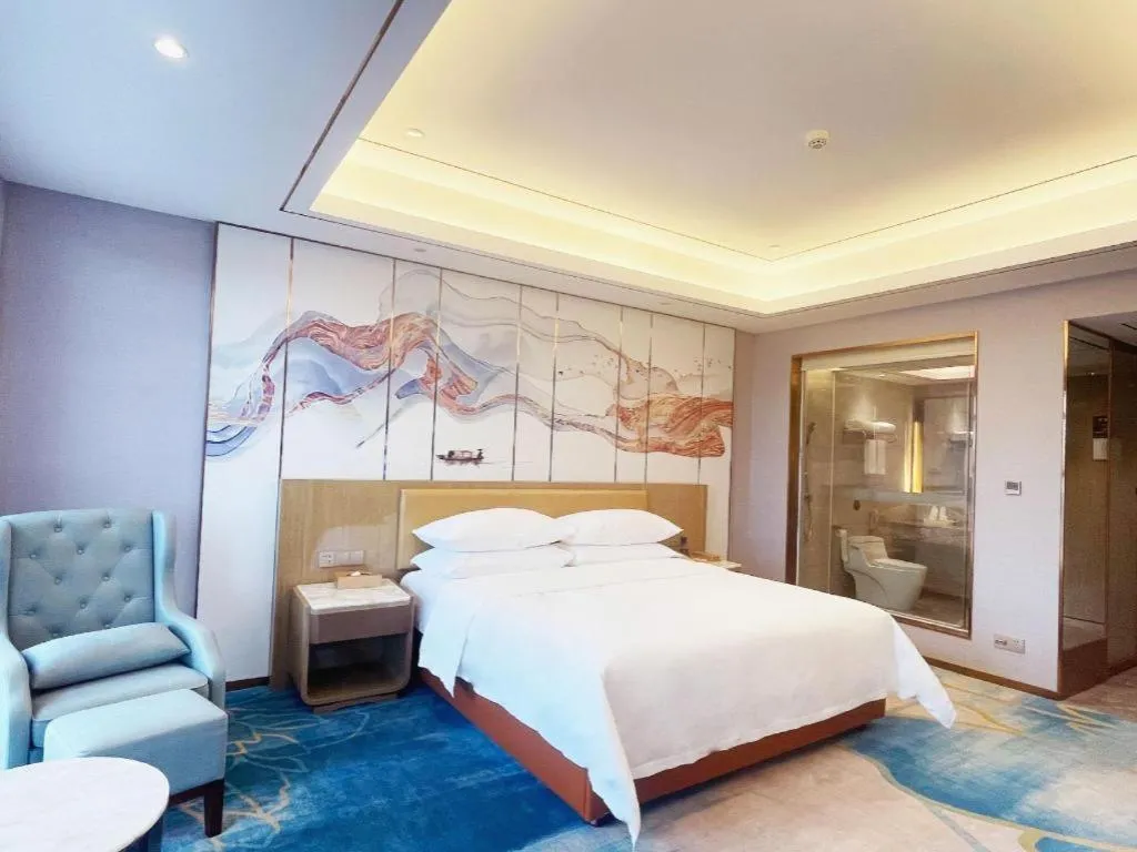 Bed in Venus Royal Hotel Guangxi Wuzhou Sanqicheng Meiguihu Park