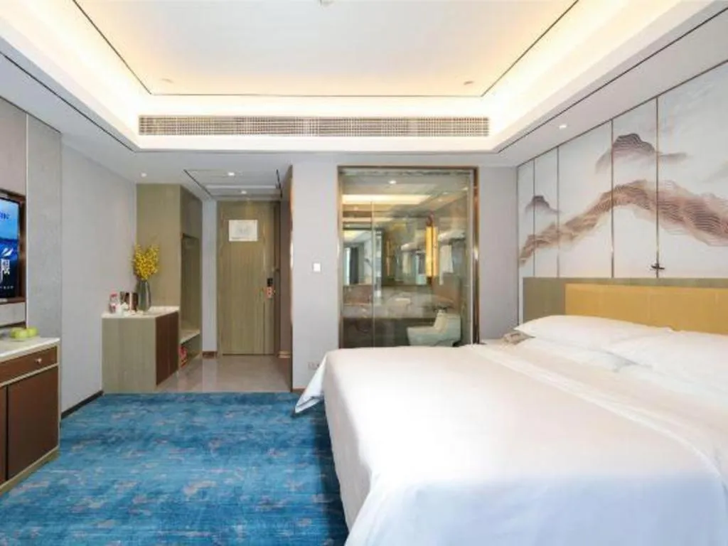 Bed in Venus Royal Hotel Guangxi Wuzhou Sanqicheng Meiguihu Park