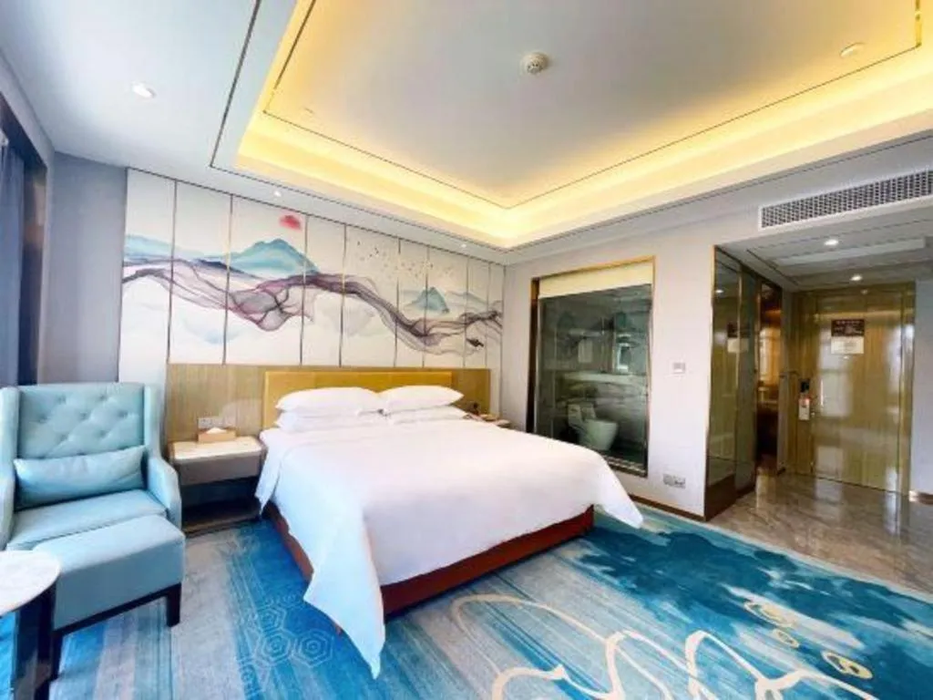 Bed in Venus Royal Hotel Guangxi Wuzhou Sanqicheng Meiguihu Park