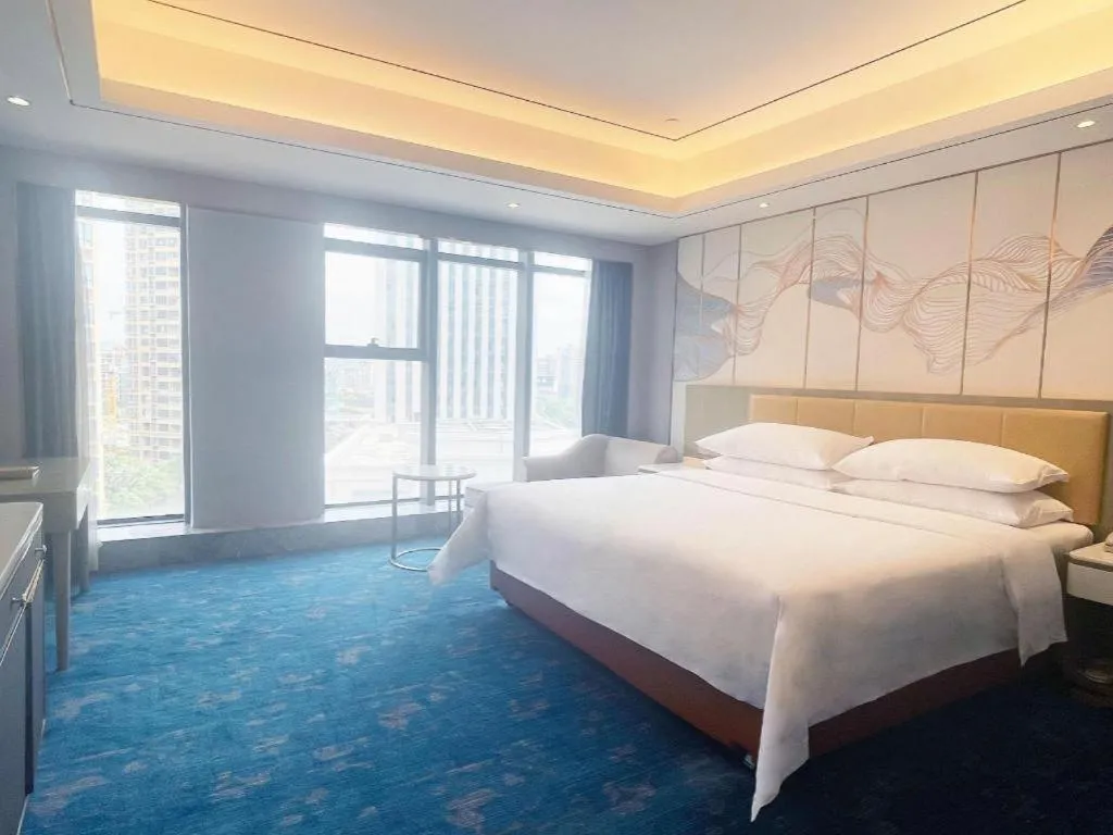 Bed in Venus Royal Hotel Guangxi Wuzhou Sanqicheng Meiguihu Park