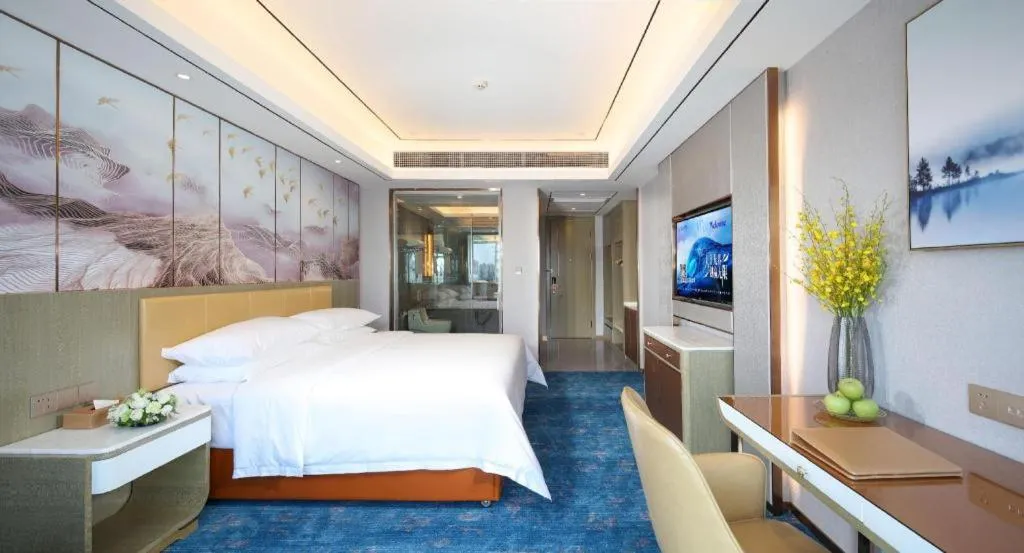 Bed in Venus Royal Hotel Guangxi Wuzhou Sanqicheng Meiguihu Park