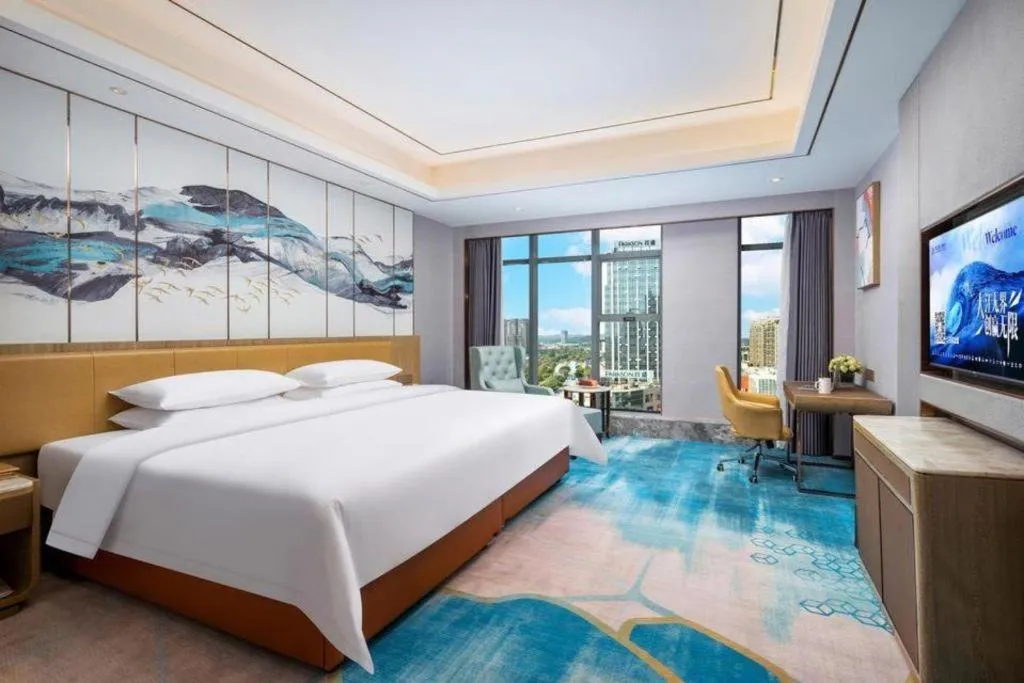 Bed in Venus Royal Hotel Guangxi Wuzhou Sanqicheng Meiguihu Park