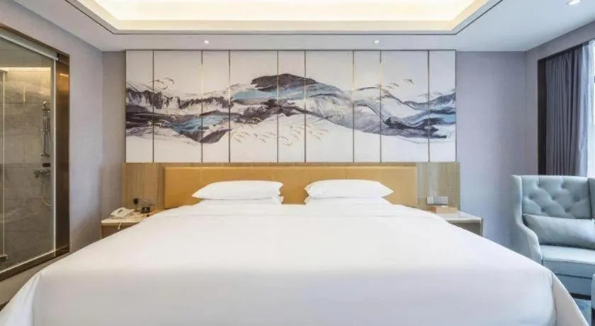 Bed in Venus Royal Hotel Guangxi Wuzhou Sanqicheng Meiguihu Park