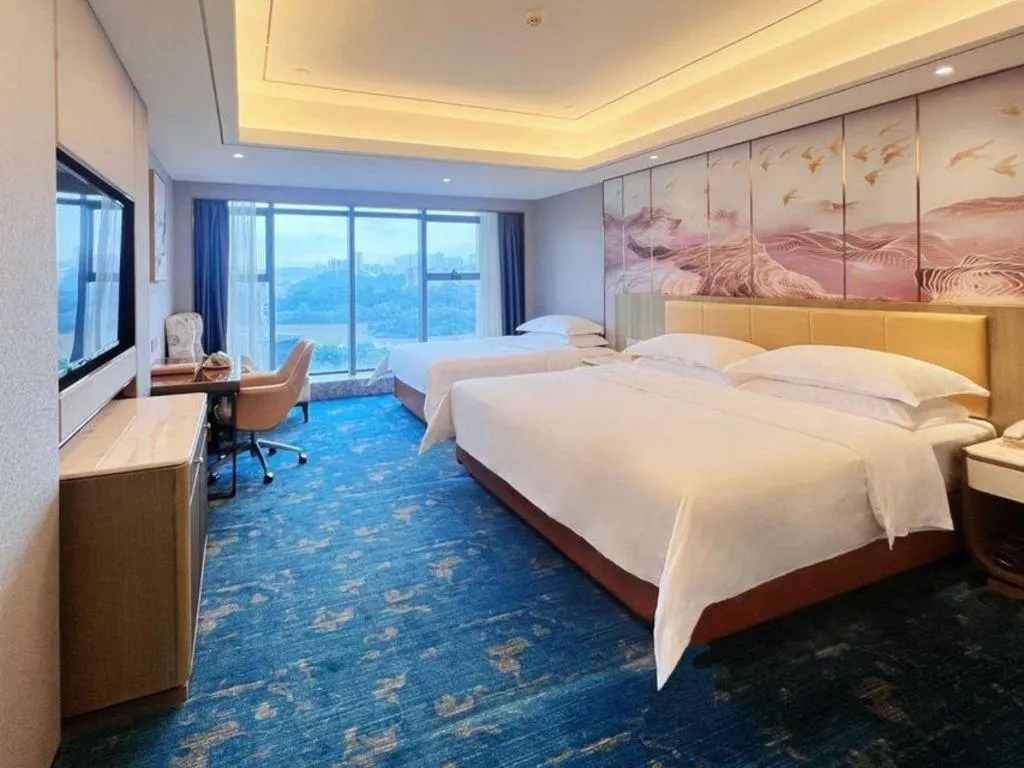 Bed in Venus Royal Hotel Guangxi Wuzhou Sanqicheng Meiguihu Park