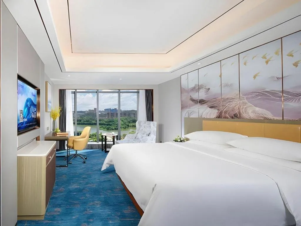 Bed in Venus Royal Hotel Guangxi Wuzhou Sanqicheng Meiguihu Park