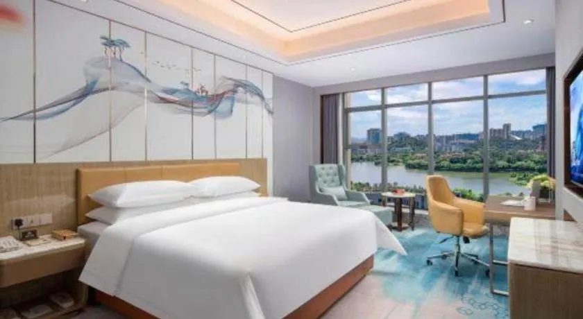 Bed in Venus Royal Hotel Guangxi Wuzhou Sanqicheng Meiguihu Park