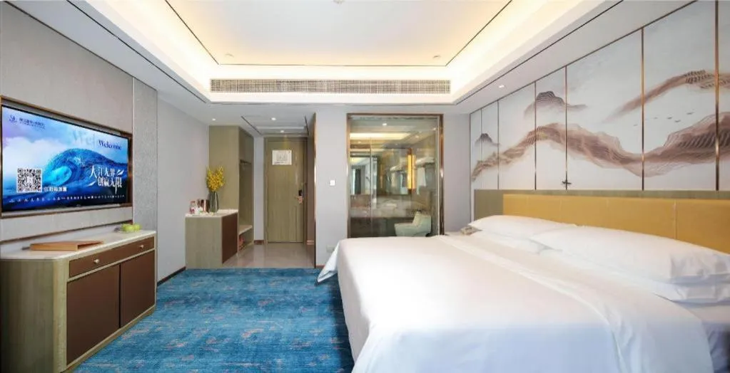 Bed in Venus Royal Hotel Guangxi Wuzhou Sanqicheng Meiguihu Park