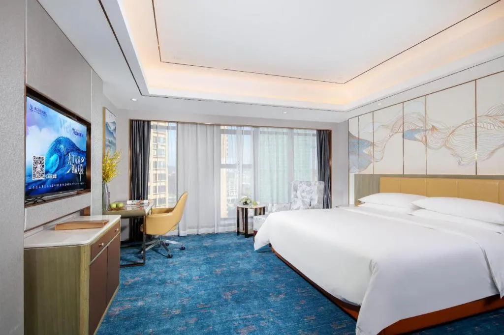 Bed in Venus Royal Hotel Guangxi Wuzhou Sanqicheng Meiguihu Park