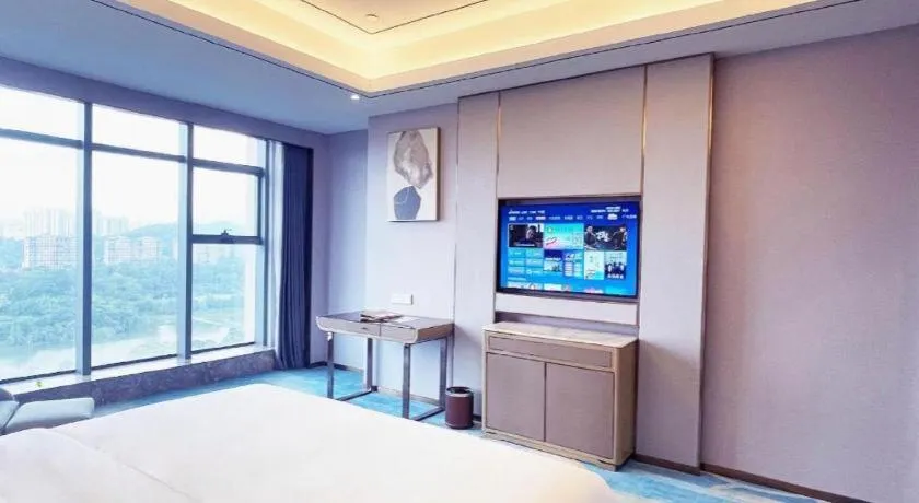 Bed in Venus Royal Hotel Guangxi Wuzhou Sanqicheng Meiguihu Park