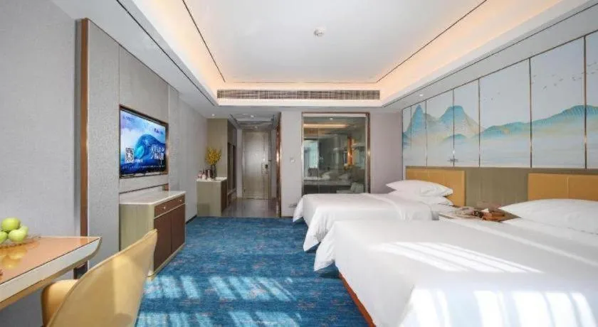 Bed in Venus Royal Hotel Guangxi Wuzhou Sanqicheng Meiguihu Park