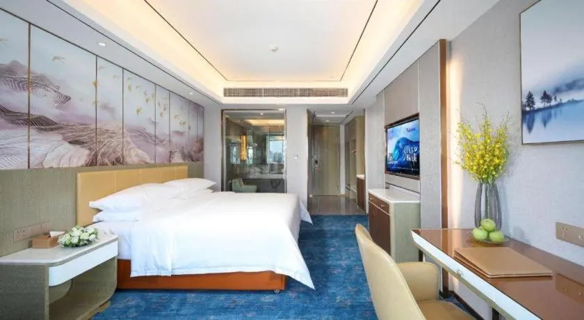 Bed in Venus Royal Hotel Guangxi Wuzhou Sanqicheng Meiguihu Park