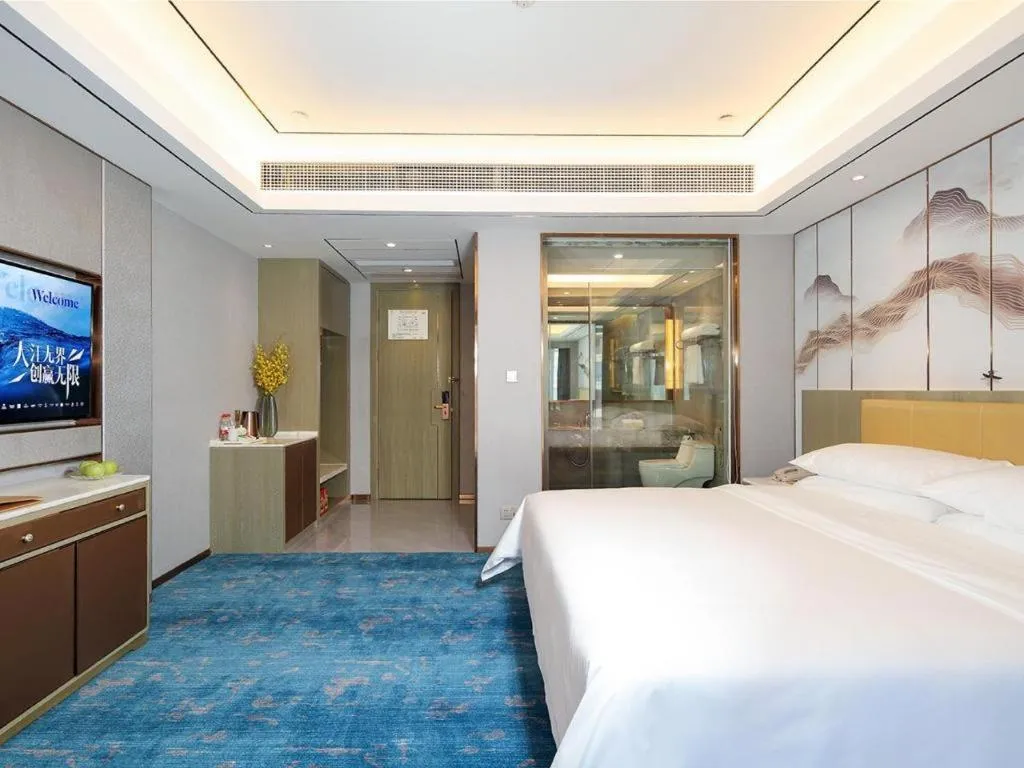 Bed in Venus Royal Hotel Guangxi Wuzhou Sanqicheng Meiguihu Park