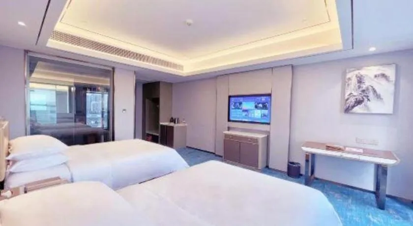 Bed in Venus Royal Hotel Guangxi Wuzhou Sanqicheng Meiguihu Park