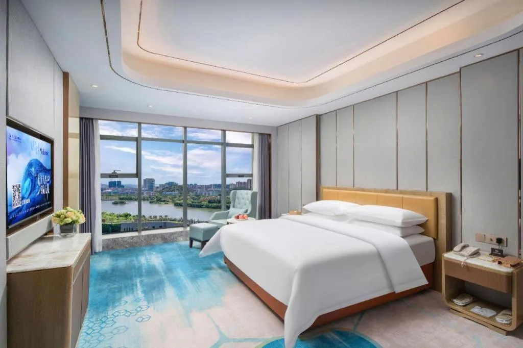 Bed in Venus Royal Hotel Guangxi Wuzhou Sanqicheng Meiguihu Park