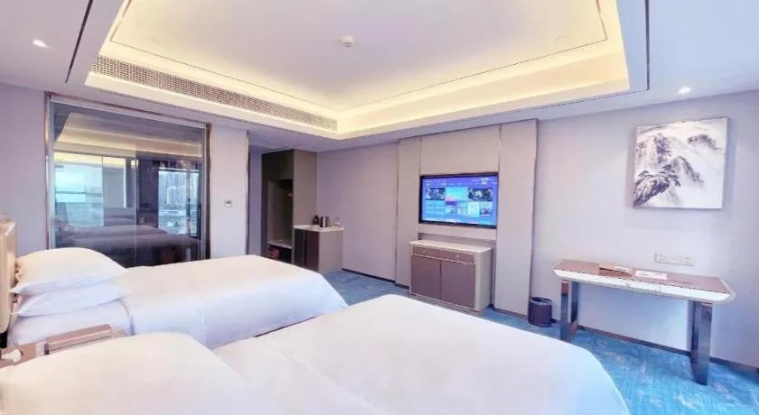 Bed in Venus Royal Hotel Guangxi Wuzhou Sanqicheng Meiguihu Park